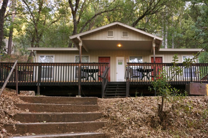 a house with a fence in front of a building