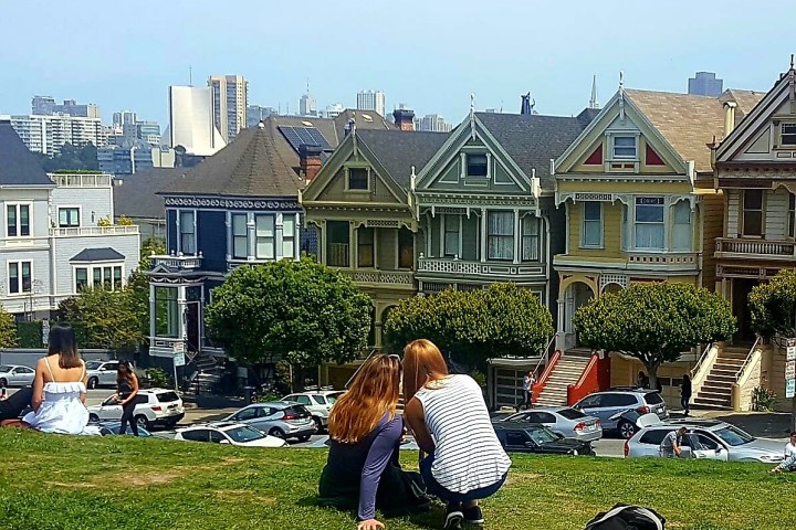 a group of people sitting in a yard